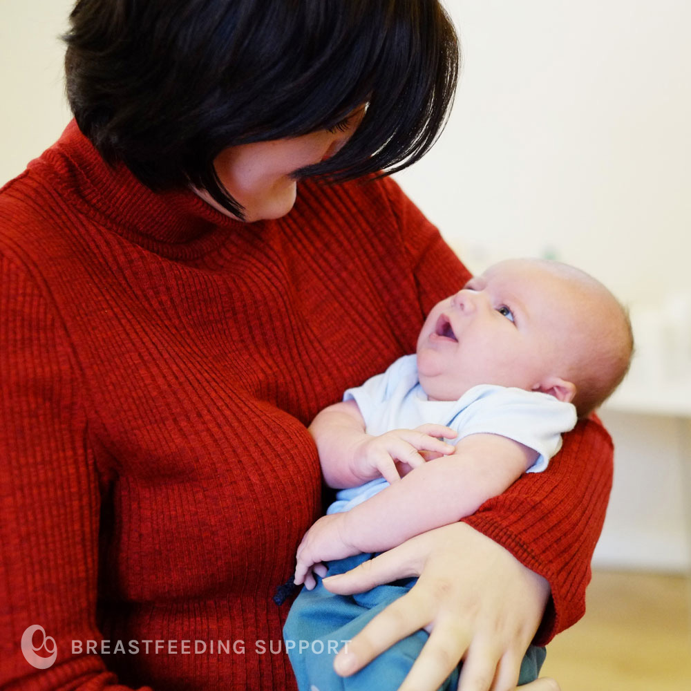 Mother looks at beautiful baby