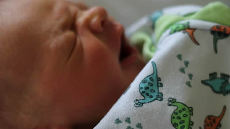 newborn baby yawning